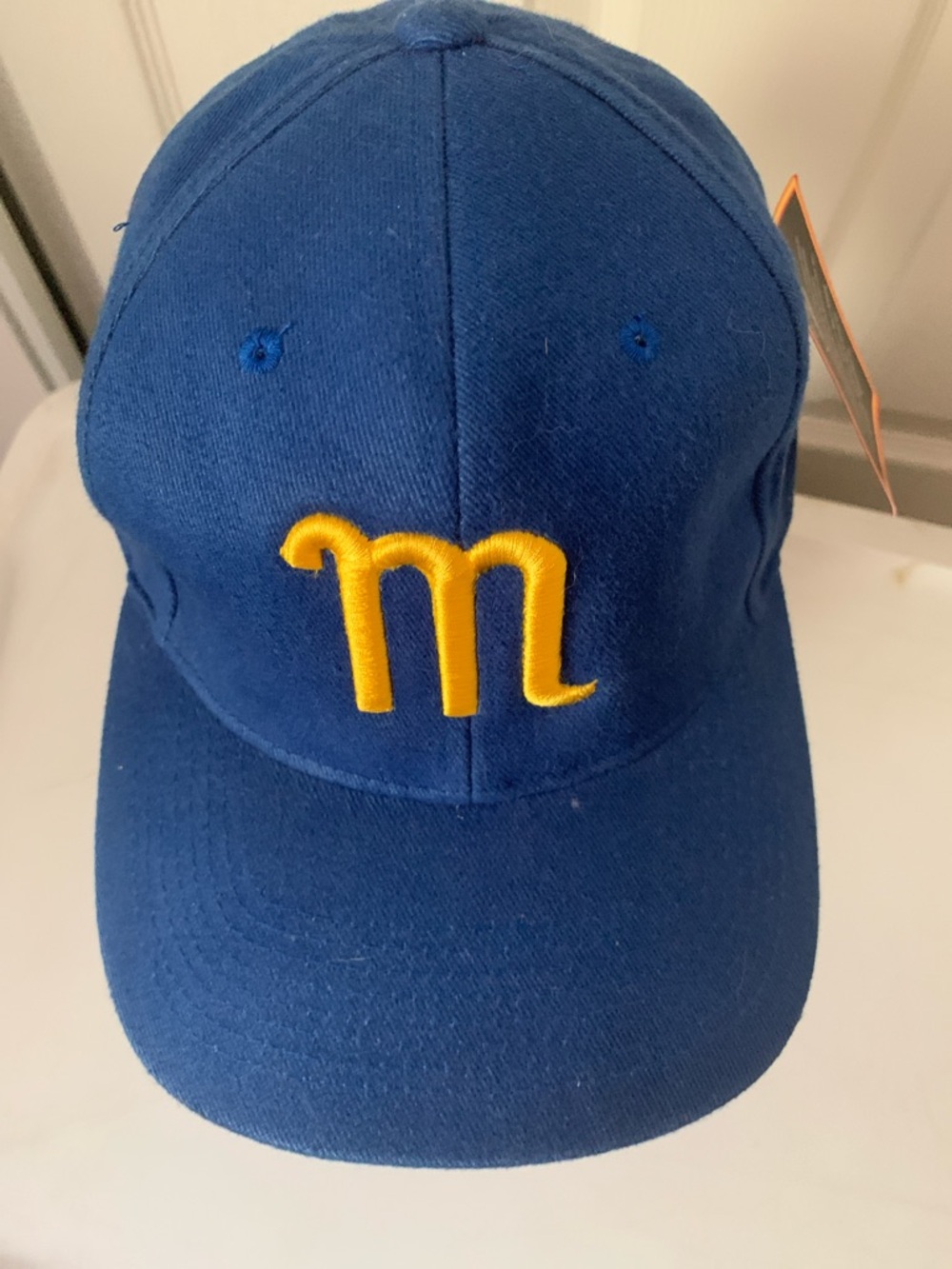 Blue Baseball Cap with Yellow Embroidered 'm'